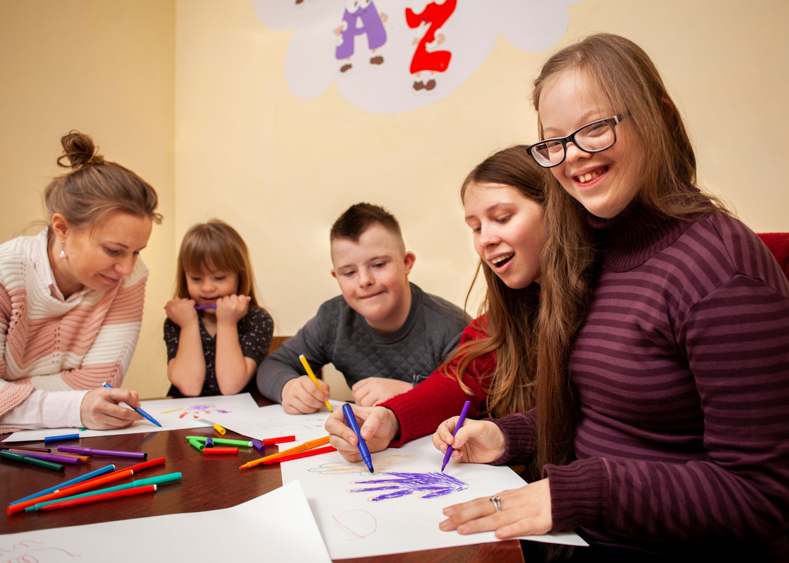 happy-girl-with-down-syndrome-posing-while-drawing (1) resized